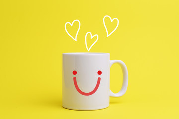 White coffee cup with smiley face