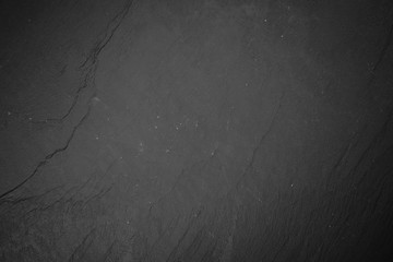 Slate board on black wood © George Dolgikh