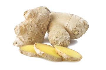 Fresh sliced ginger root and leaves on the white