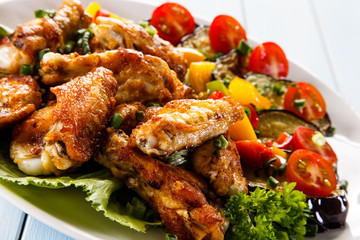 Grilled chicken wings and vegetables