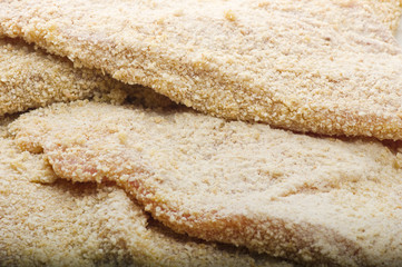 group of schnitzel ready to fry on plate