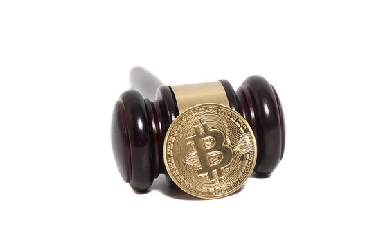 Wooden judge gavel with Golden Bitcoin coin (digital virtual mon