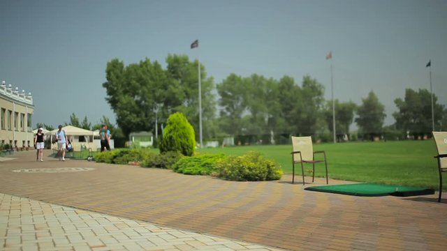 Two couples communicate in golf club