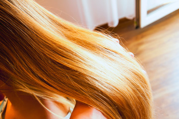 Long blonde hair of young girl