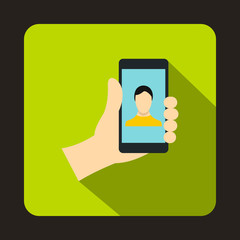 Hand holding smartphone with photo icon in flat style with long shadow. Device symbol