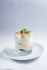 dessert with whipped cream in a transparent glass