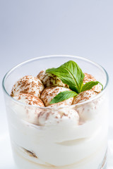 dessert with whipped cream in a transparent glass