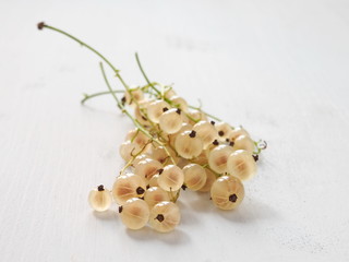 Pile of White Currants Arranged on Light Gray Wooden Table