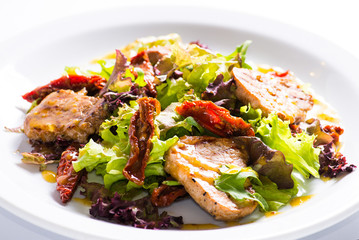 dish of salad with vegetables and meat