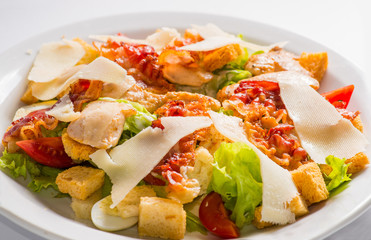 dish of salad with vegetables and meat