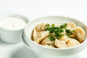 Dumplings in a white plate. Serving for the restaurant menu