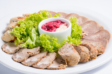 meats on a white plate. Snack from the restaurant menu