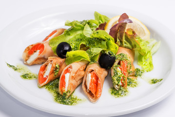 pancakes with seafood on a white plate. Serving for the restaurant menu