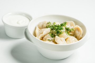 Dumplings in a white plate. Serving for the restaurant menu