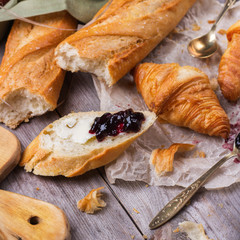 French baguette with butter and jam for breakfast