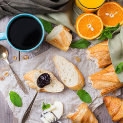 French baguette with butter and jam for breakfast