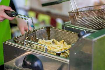 cooking  fries at a fast food restaurant