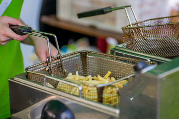 cooking  fries at a fast food restaurant