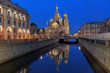 St. Petersburg, Russia. Church of the Savior on Spilled Blood reflecting in Griboyedov Canal at night. View from the north side.