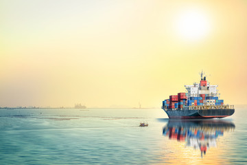 Logistics and transportation of International Container Cargo ship in the ocean at sea sunset time,...