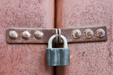 Rusty lock on garage gate