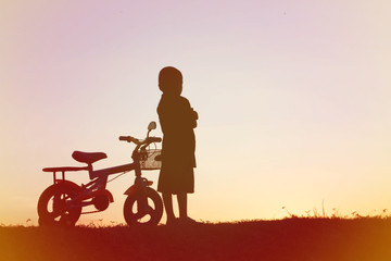 Fototapeta na wymiar little boy bike silhouette