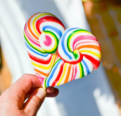 Heart shaped lollipop in the hand