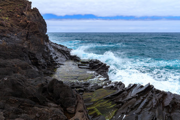 Seixal ocean natural pools and bay at Madeira northern coastline. Portugal.