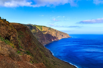 Fototapeta na wymiar Beautiful Madeira landscape with azure water and green cliffs, Portugal