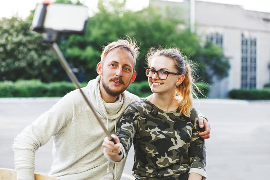 Young happy couple making selfie