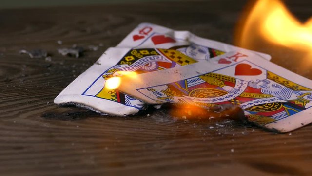 Burning king and queen of hearts card