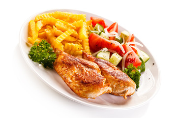 Fried chicken fillet, chips and vegetable salad 