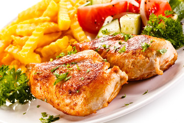 Fried chicken fillet, chips and vegetable salad 
