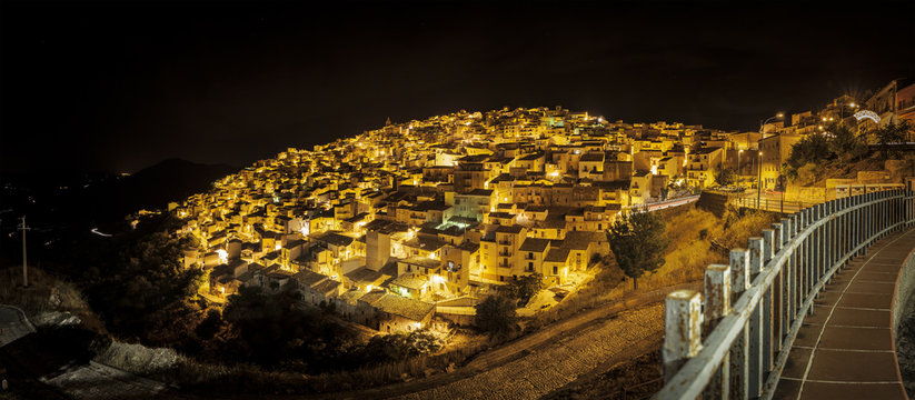 Nocturnal panoramic view of Prizzi, Italy.