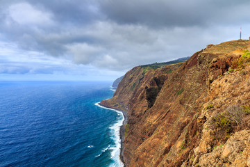 Beautiful Madeira landscape with azure water and green cliffs, Portugal