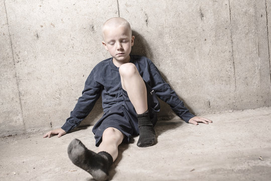 Neglected Lonely Child Leaning At The Wall