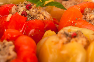 Bell peppers filled with minced meat, rice and vegetables, close up