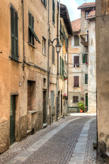 Facades of houses in a small street in the small mountain village Sassello in the north of Italy
