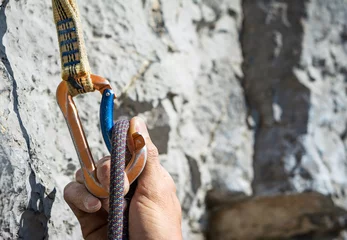 Foto op Plexiglas Carabiner, spit and climbing rope. Free   climbing gear © ueuaphoto