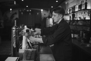 Barman at work in the pub