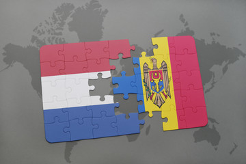 puzzle with the national flag of netherlands and moldova on a world map background.