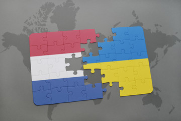 puzzle with the national flag of netherlands and ukraine on a world map background.