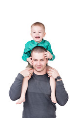 baby son riding father's shoulders isolated on white