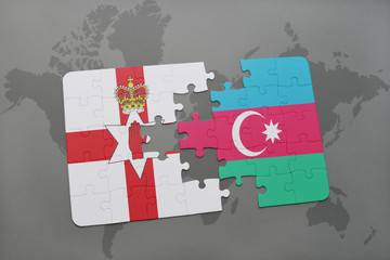 puzzle with the national flag of northern ireland and azerbaijan on a world map background.