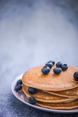 pancakes with blueberries and honey