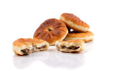 Traditional russian meat pies belyashi isolated on white background