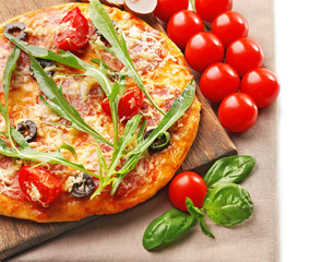 Delicious pizza with vegetables and herbs