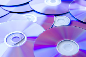 Many Compact Discs scattered seen up close