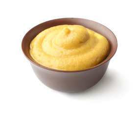 Fresh mustard isolated on white