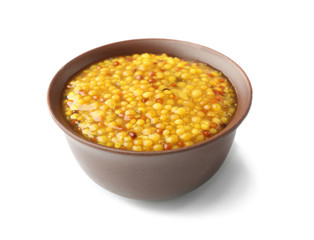Bowl of French mustard isolated on white